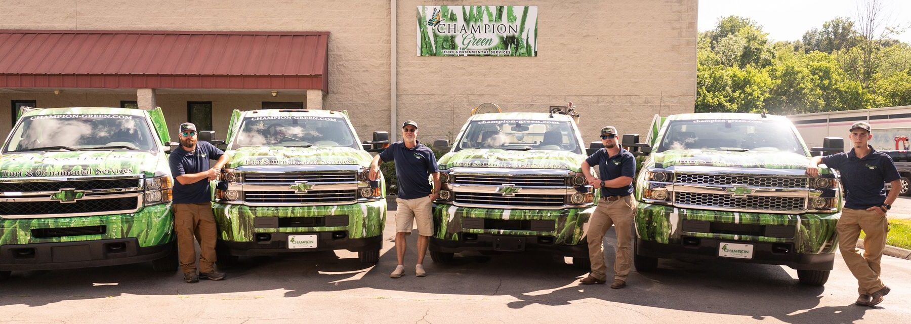 Champion Green team and service fleet delivering professional lawn care in Dalton GA